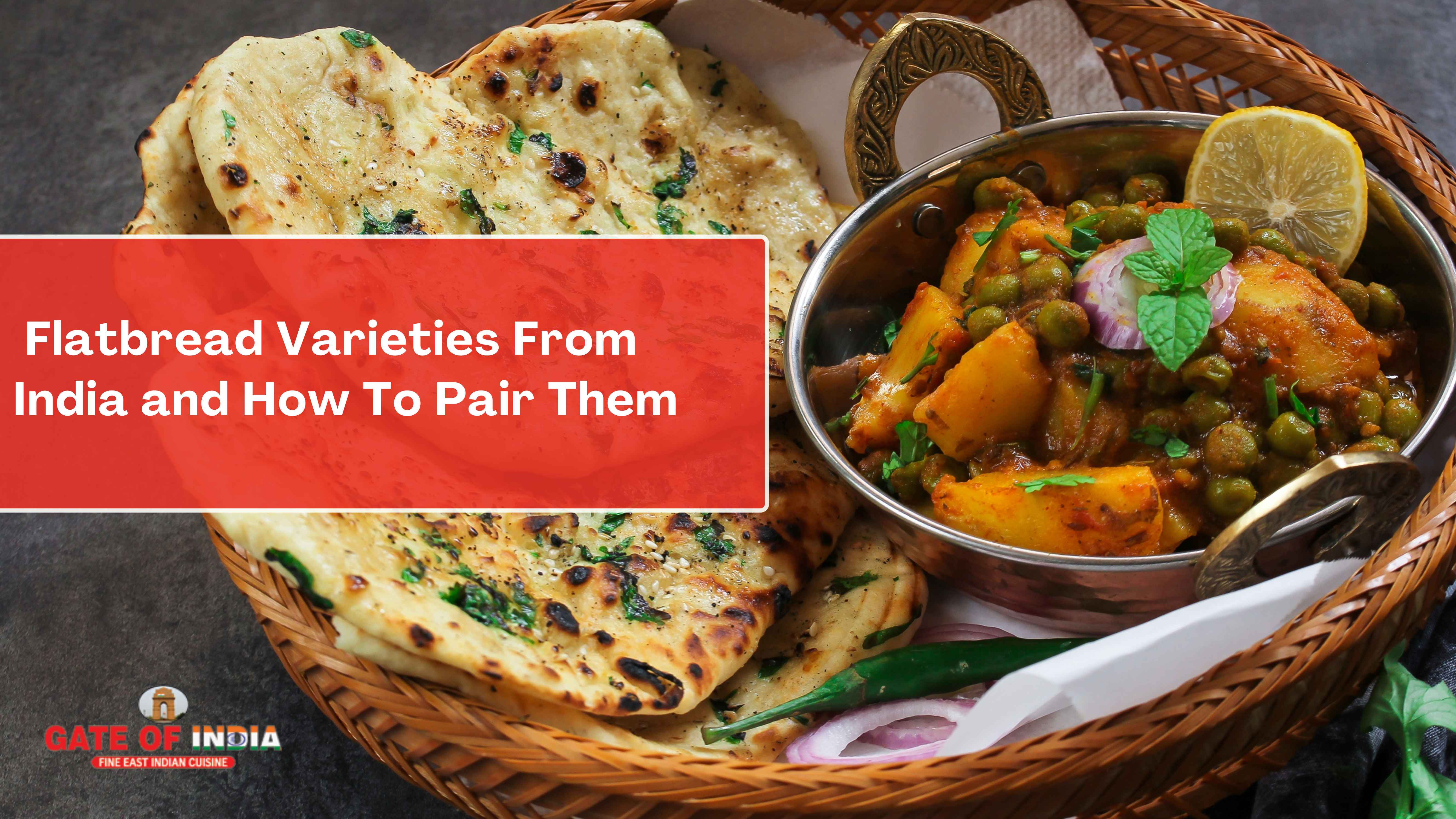 Indian naan flatbreads in a basket alongside Aloo Matar curry at Gate of India Calgary